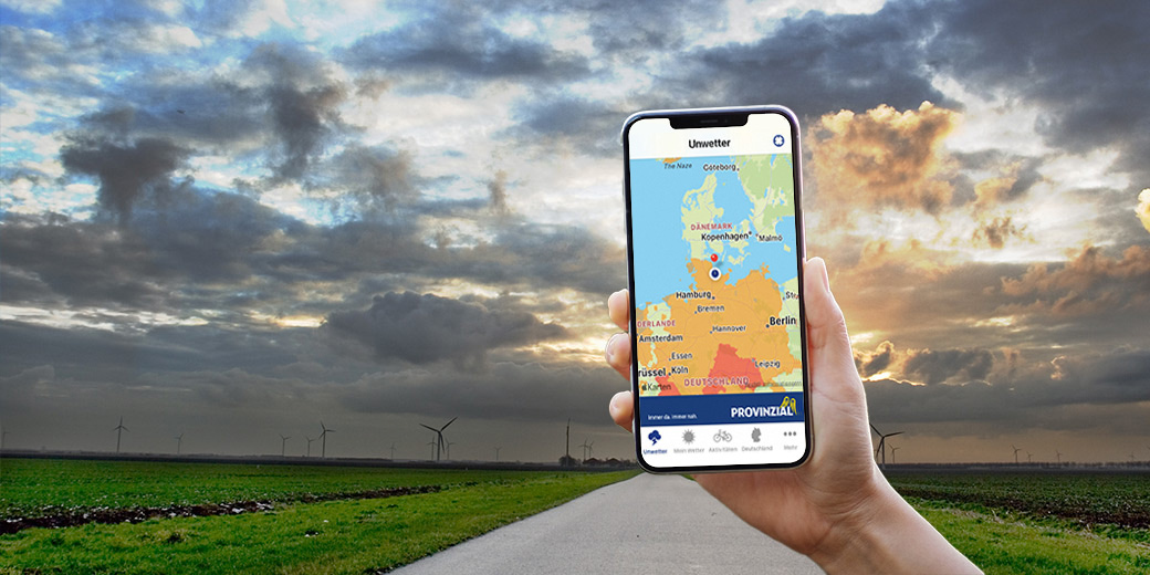Auf einem Smartphone wird eine Unwetterwarnung angezeigt